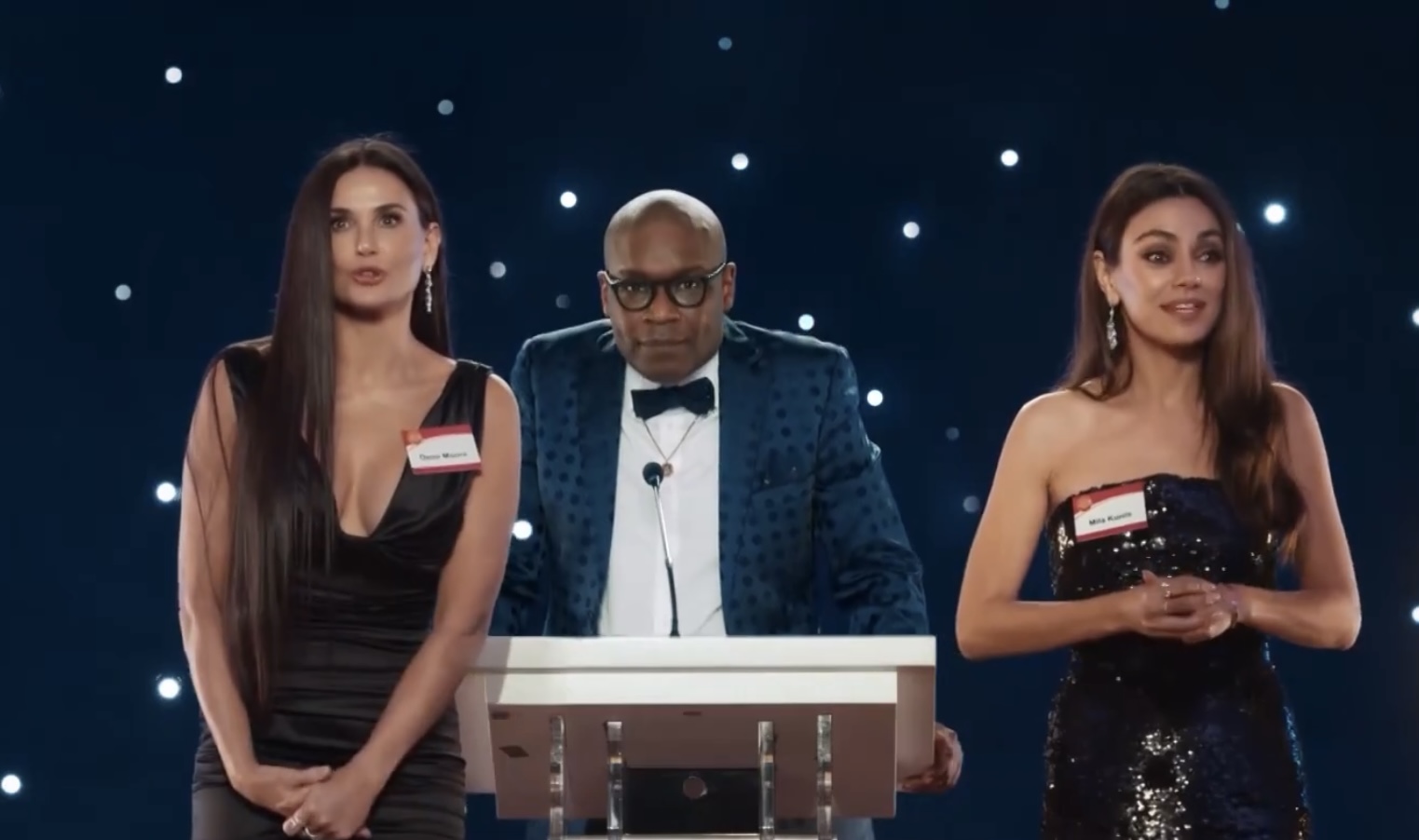 Mila Kunis & Demi Moore Joke That They Have ‘A Lot In Common’ In New AT&T Commercial Together
